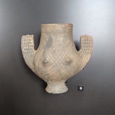 Anthropomorphic clay vessel with a modeled breast.